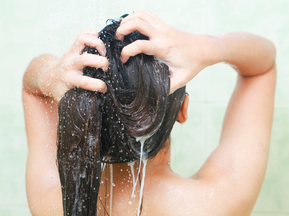 Curly hair being washed