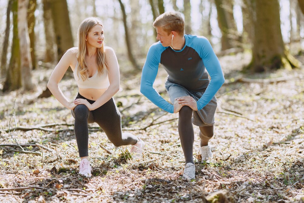 photo of couple exercising while looking at each other 4148944