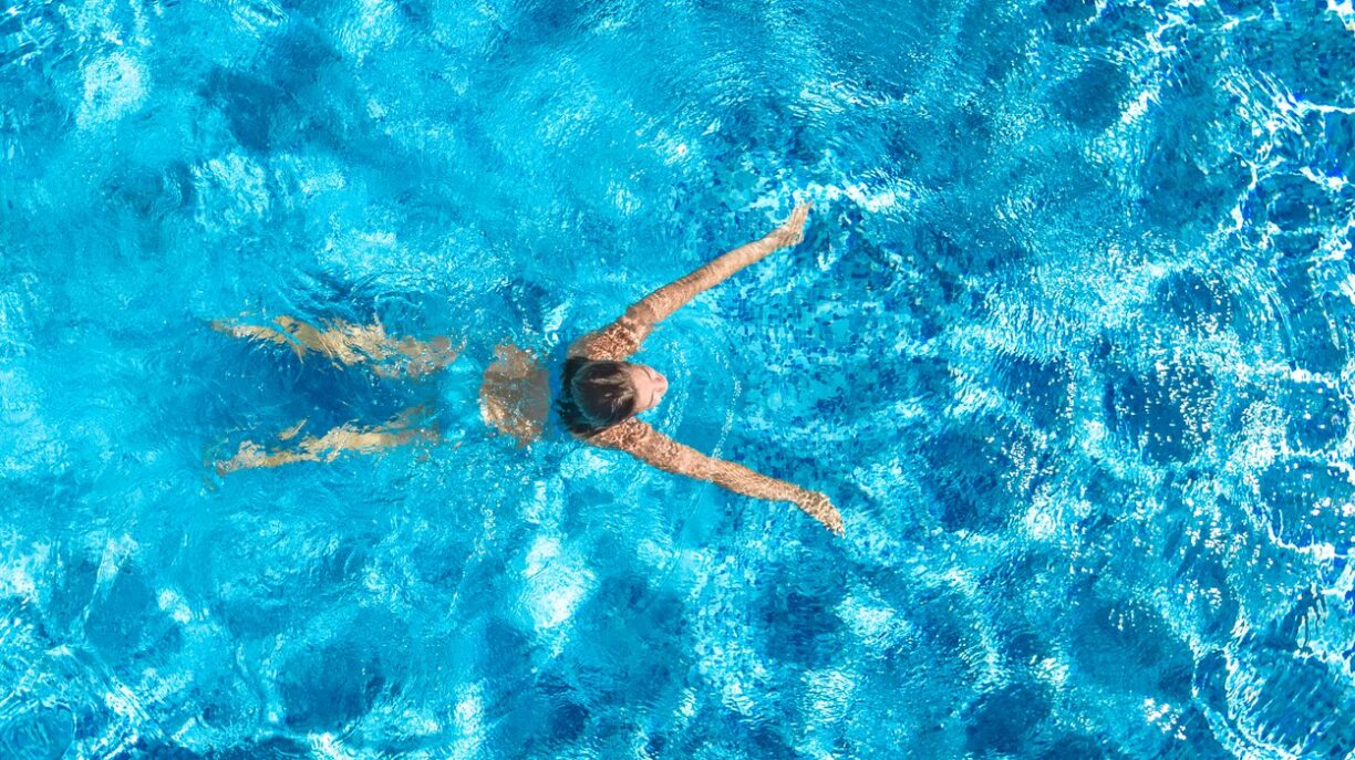 Woman swims in pool