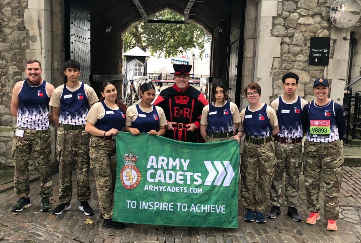 Army cadets national ambassador sally orange and cadets from city of london and north east sector acf at the end of the tower of london marathon.