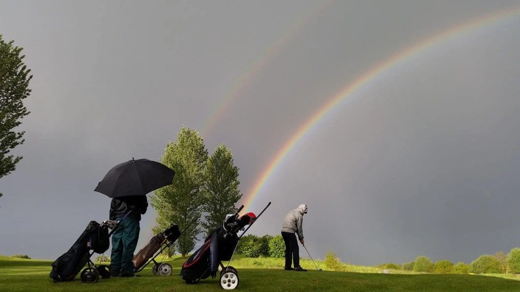 Golfers in the rain