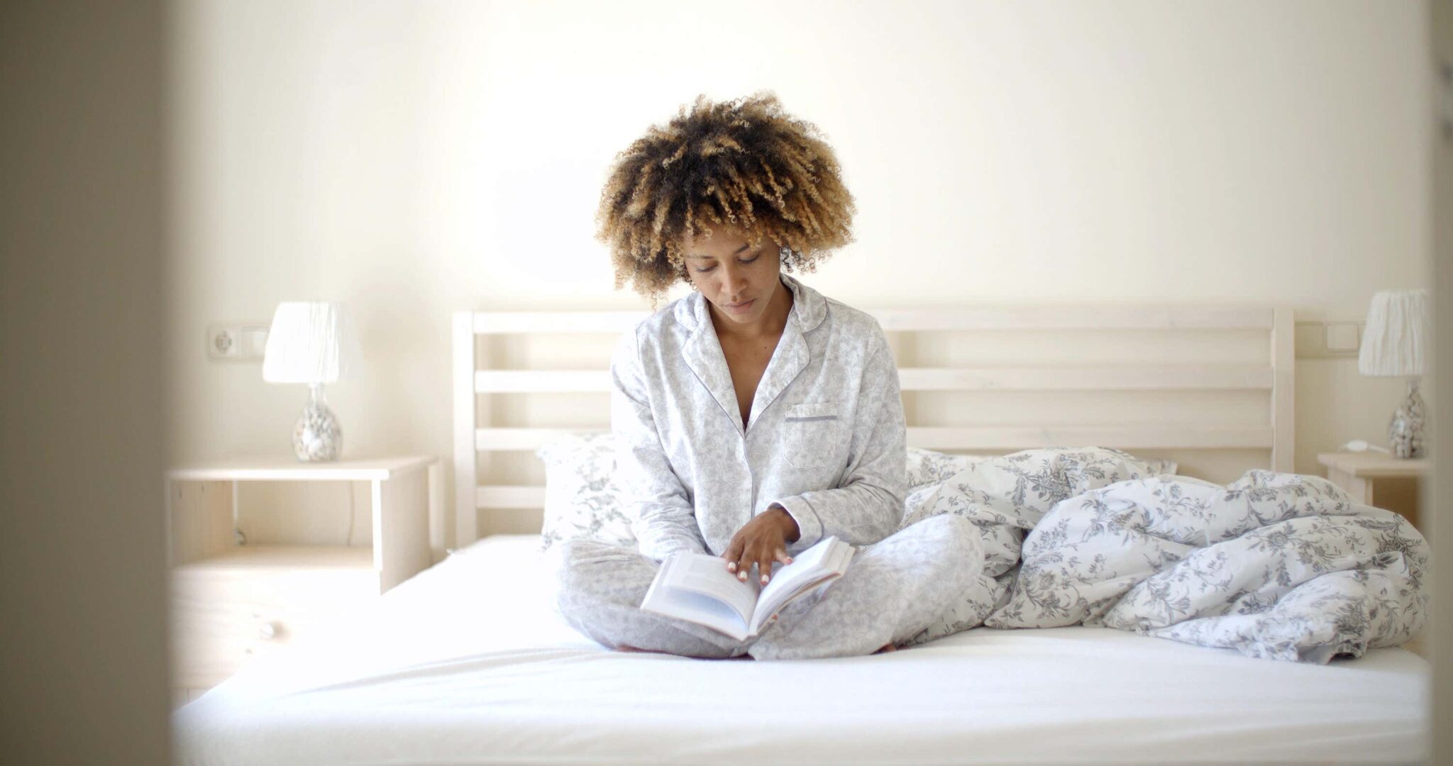 woman on bed reading