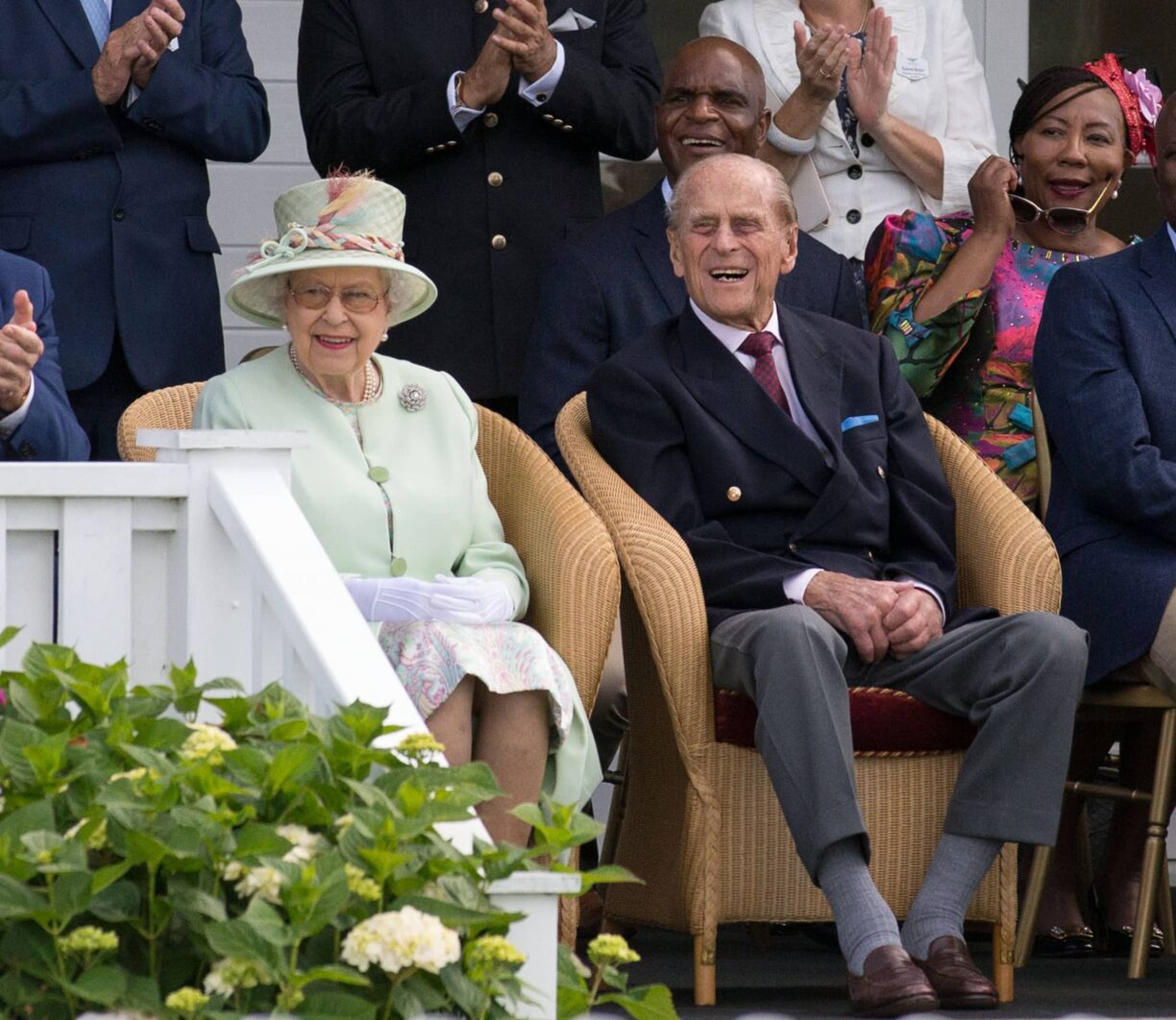 The queen sits next to the duke of edinburgh