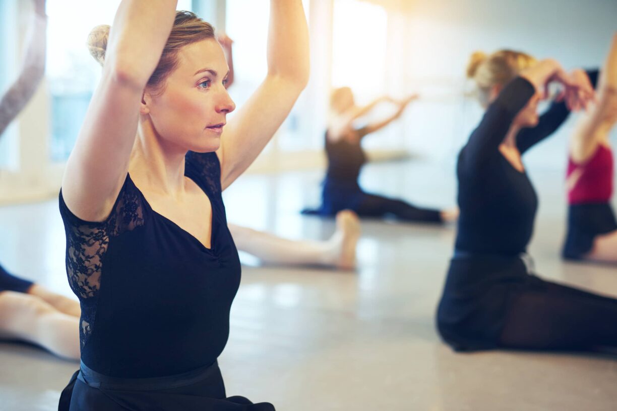 Women stretch in exercise class
