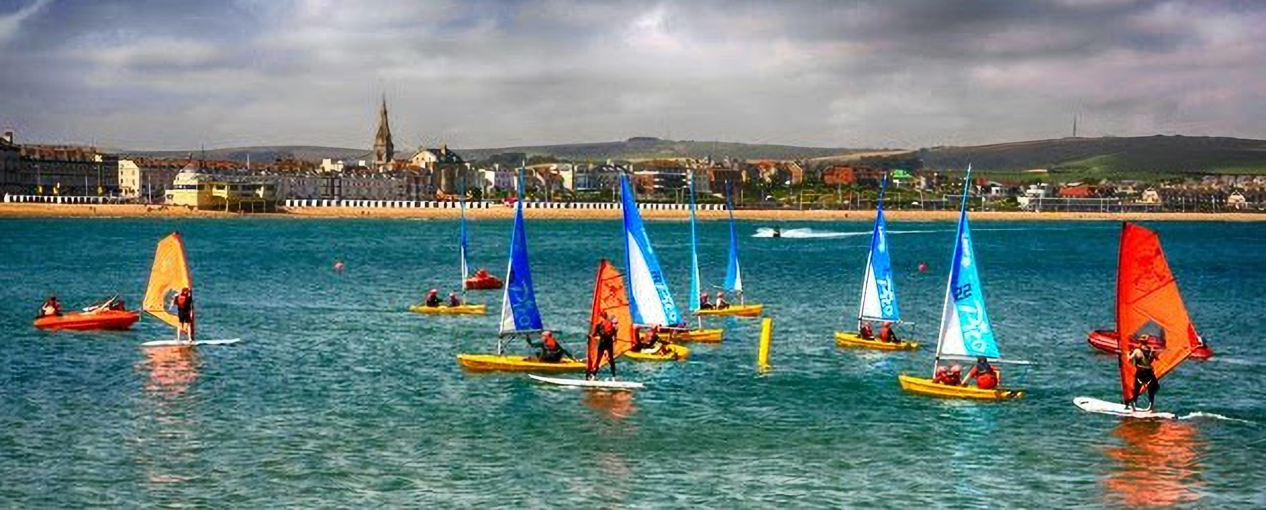 paddleboarders in weymouth sea