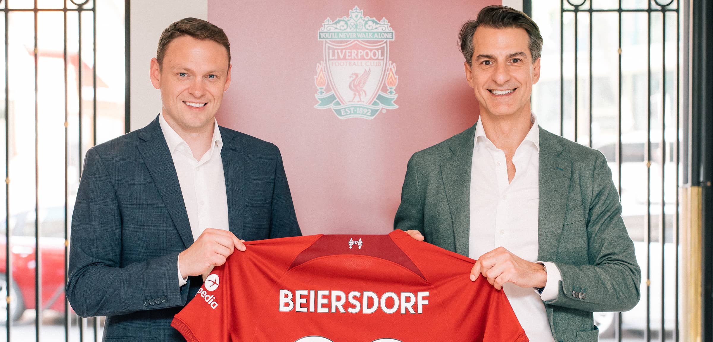 Ben latty, liverpool fc commercial director and oswald barckhahn, member of the executive board beiersdorf